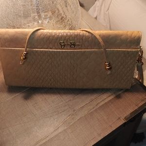 Jessica Simpson under arm wristlet